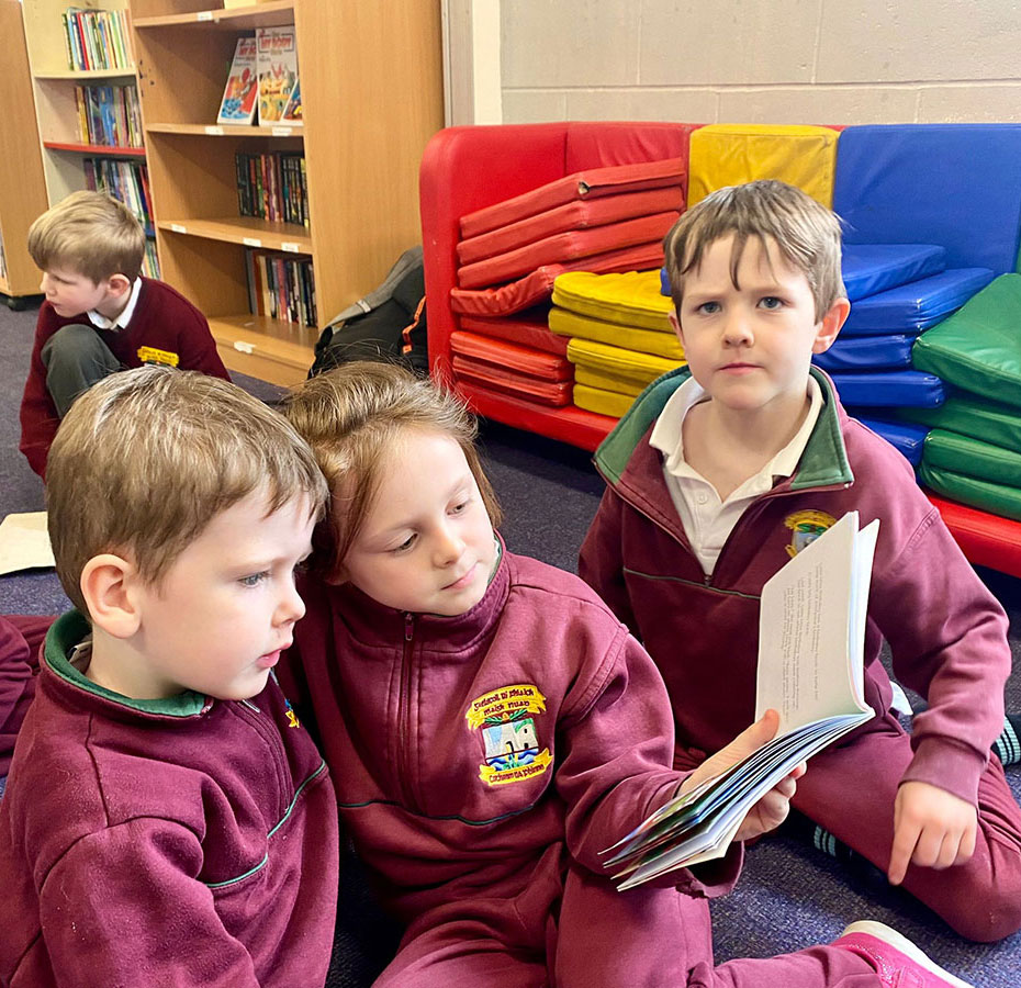 Children reading a story at the Infant After School Club